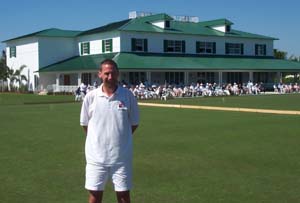 Photo of John Moore standing in front of the club house at the National Croquet Center in Florida.